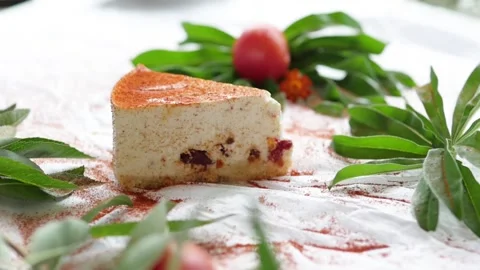 Cheesecake with tomatoes. white pie surrounded by green leaves Stock-Footage 147444036