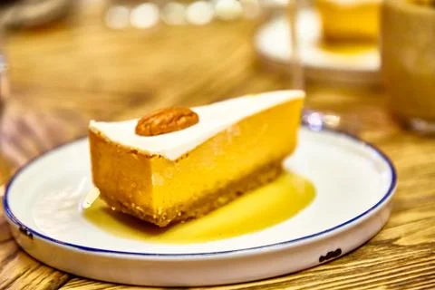 Cheesecake with walnuts on the plate. Stock Photos