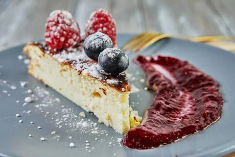 Cheesecake without dough with red fruit sauce Stock Photos