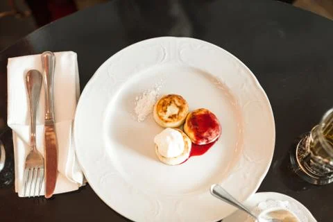 Cheesecakes for breakfast in the restaurant Stock Photos