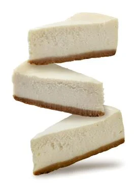 Cheesecakes falling close up on a white background. Isolated Stock Photos