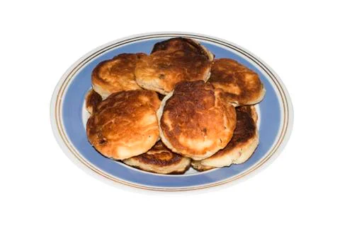 Cheesecakes on a plate on a white background. Stock Photos