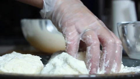 Cheesecakes roll in flour before frying Stock Footage 112508722