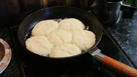 Cheesecakes round shape fried in a cast iron skillet Stock Footage 82345650