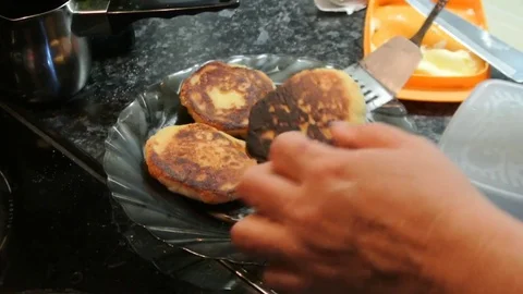 Cheesecakes round shape fried in a cast iron skillet Stock Footage 82345975