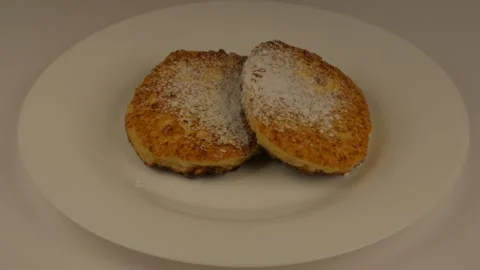 Cheesecakes Sprinkled with Powdered Sugar Stock Footage 297774106