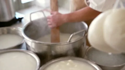 A cheesemaker prepares mozzarella Stock Footage 167699669