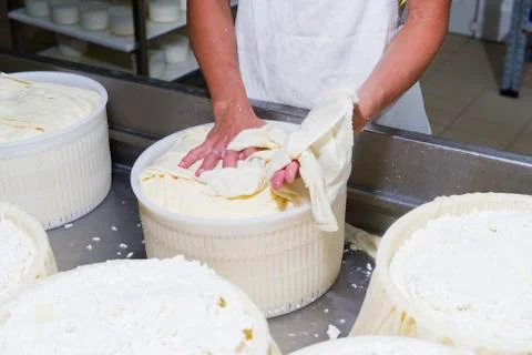 Cheesemaker preparing fresh cheese Stock Photos