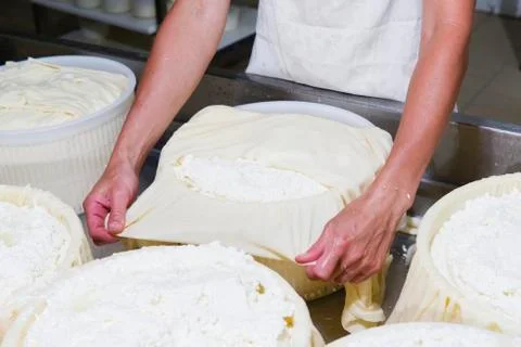 Cheesemaker preparing fresh cheese Stock Photos