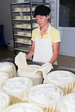 Cheesemaker preparing fresh cheese Stock Photos