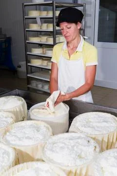 Cheesemaker preparing fresh cheese Stock Photos