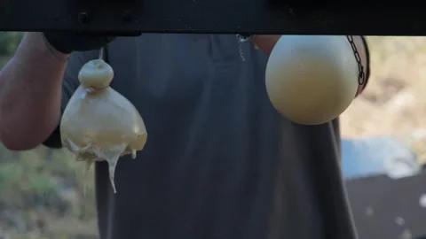 Cheesemaker preparing traditional Caciocavallo cheese in Salerno Stock Footage 339365620