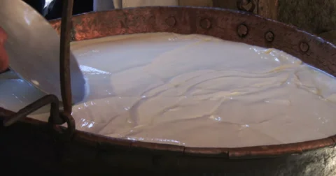 Cheesemaking of Mountain Cheese in a log cabin. Part 8 of 14. Stock Footage 69064529