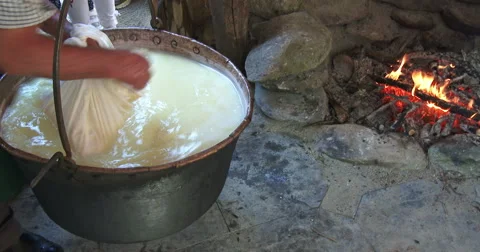 Cheesemaking of Mountain Cheese in a log cabin. Stock-Footage 69157156