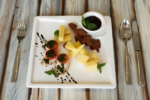 Cheeseplate with souce on a table Stock Photos