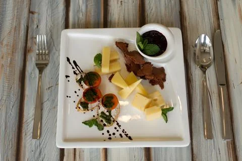 Cheeseplate with souce on a table Stock Photos