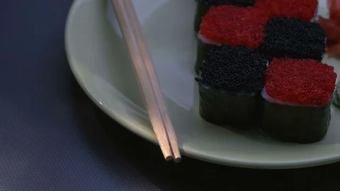 "Cheess" square sushi rolls with salmon, cucumber, cream cheese, red and black Stock Footage 75033617