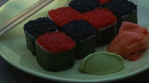 "Cheess" square sushi rolls with salmon, cucumber, cream cheese, red and black Stock-Footage 75175968