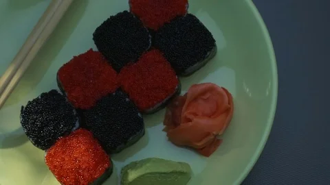 "Cheess" square sushi rolls with salmon, cucumber, cream cheese, red and black Video stock 75176155