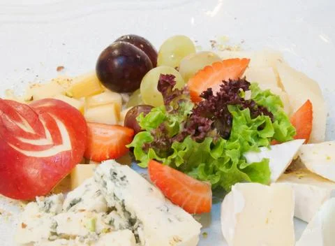 Cheesses with fruit Stock Photos