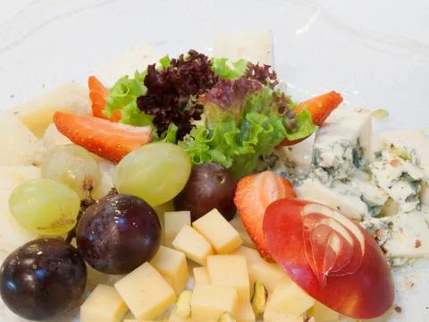 Cheesses with fruit Stock Photos