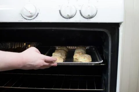 Cheesy Biscuits in an Oven Stock Photos