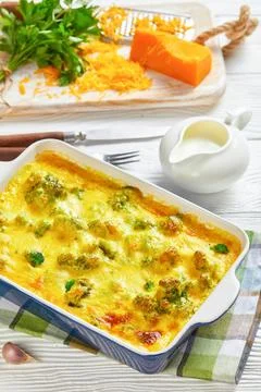 Cheesy broccoli bake in a baking dish Stock Photos