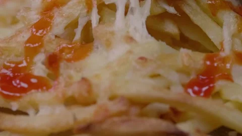 Cheesy Chips with Ketchup Pulled in Slow Motion Stock Footage 166863036