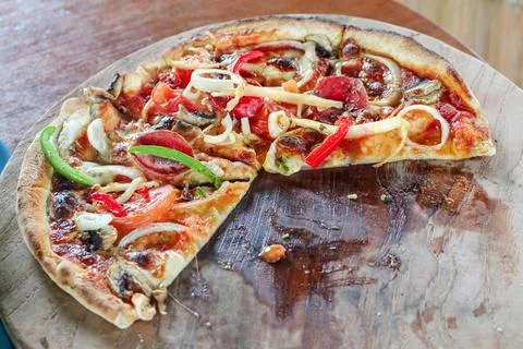 Cheesy mozzarella pizza slice under natural daylight. Ensure every detail, .. Stock Photos