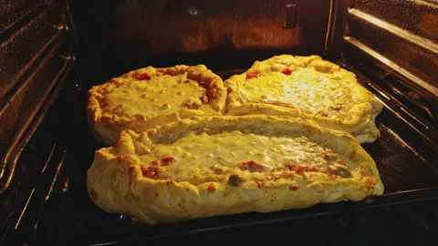Cheesy Pizzas Baking in Oven Stock Footage 277691533