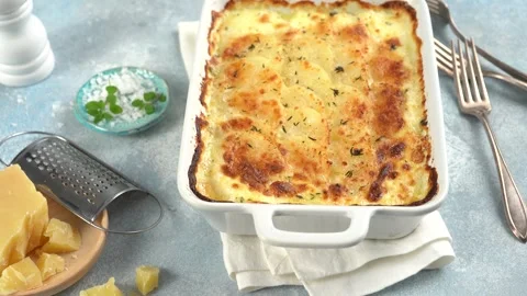 Cheesy scalloped potatoes with thyme and parmesan Stock Footage 242526010