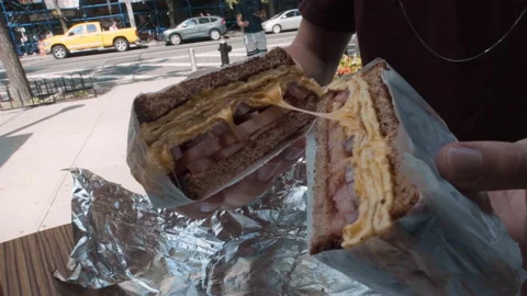 Cheesy Take Away Sandwich Split in Half Tasty Aluminum Foil Stock Footage