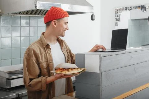 Chef accepts order from internet in a cafe Stock Photos