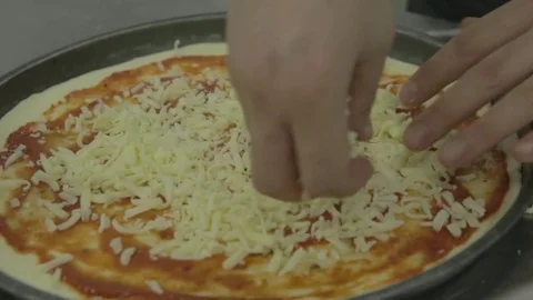 Chef add cheese to pizza Stock Footage 81430723