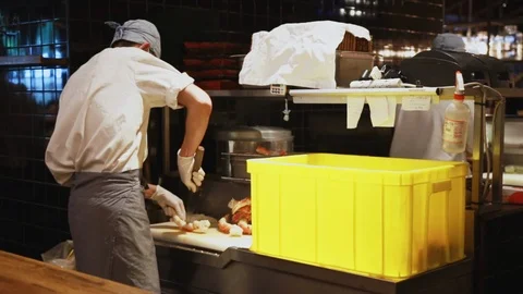 Chef at Addiction Aquatic Development slicing fish and seafood Video stock 107039355