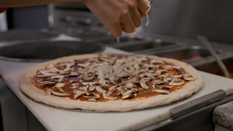 Chef Adding Cheese to Pizza – Fresh Pizza Topping Preparation 動画素材 303203604