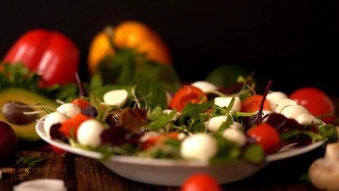 Chef adding diced marinated meat to a fresh salad Stock-Footage 105111378