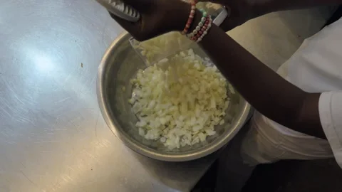 Chef Adding Diced Onions to Metal Bowl Stock Footage 339642757