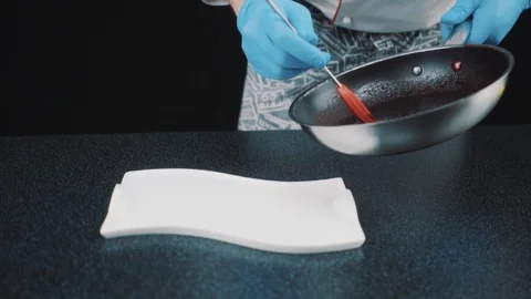 Chef adding finishing touch Stock Footage 88714254