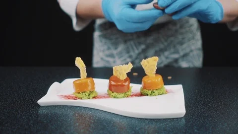 Chef adding finishing touch Stock Footage 88714971