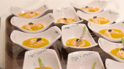 Chef adding fresh aroma flowers on shrimp soup Video stock 282106473