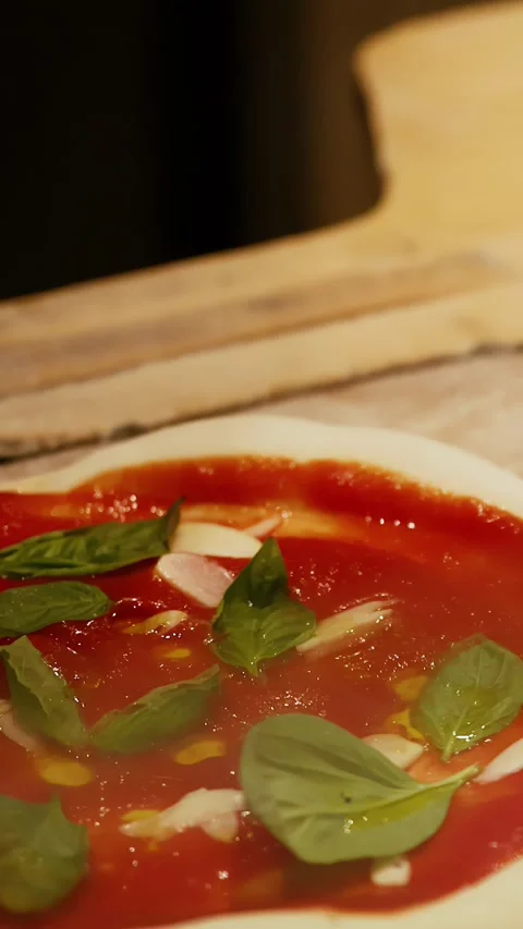 Chef Adding Fresh Prosciutto To Italian Pizza With Basil And Tomato Sauce Stock Footage 339513550