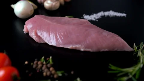 Chef adding fresh rosemary to a raw chicken breast Stock-Footage 105112663