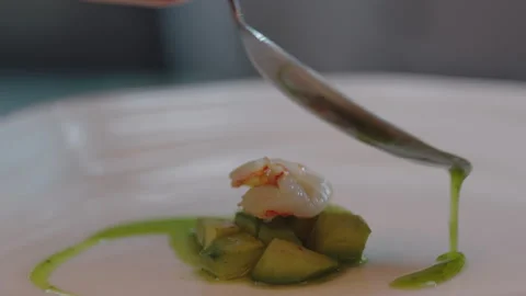 Chef adding green sauce over cucumber and prawn Stock Footage 283005218