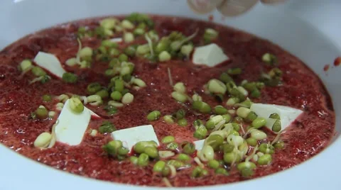 Chef  is adding lentil to vegetable soup with tofu cheese Stock Footage 48397812