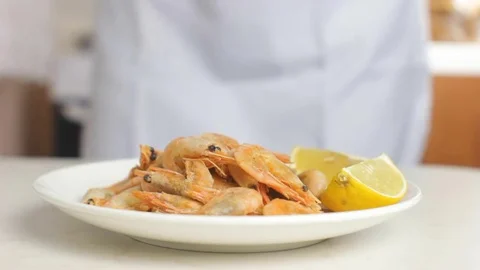 Chef Adding Minced Parsley to Shrimps Stock Footage 83165761