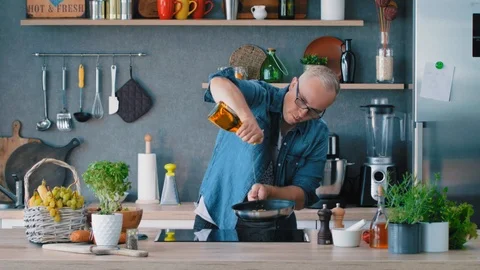 Chef Adding Olive Oil In a Pan Stock Footage 93064751