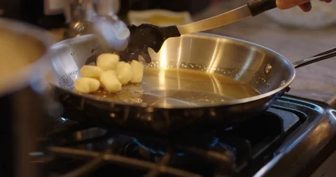 Chef Adding To Pan 스톡 동영상 105371058