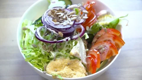 Chef adding sauce to the salad Stock Footage 77039611