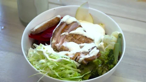 Chef adding sauce to the salad slow motion Stock Footage 77037026